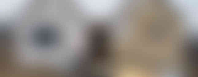 Exterior entry view of a modern, v-shaped cabin retreat and ADU in Monitor, WA by modFORM LLC