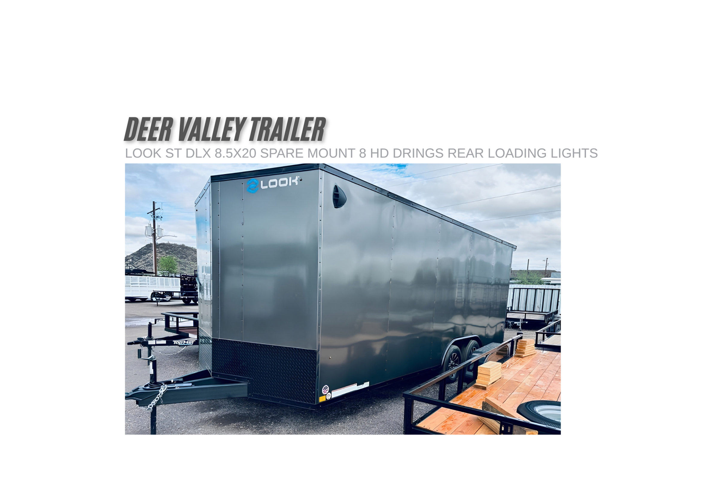 Front V-nose view of a charcoal Look Trailers ST DLX 8.5x20 enclosed cargo trailer model K-DXC10220-070 showing the aluminum