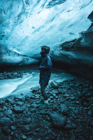 Ice cave with stunning blue ice inside - perfect for adventurous explorers seeking natural wonders