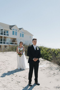 Oceanfront wedding portraits of a newly married couple in Corolla, North Carolina