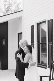 bride/and/father/hugging