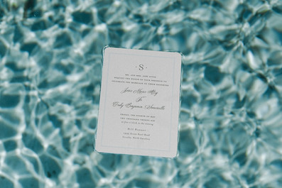 Coastal wedding invitation suite in pool