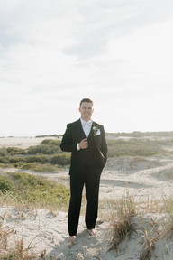 Candid newlywed portraits during a coastal destination wedding weekend