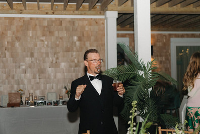 Wedding guests dancing under string lights at an Outer Banks wedding