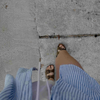 Women in stripe shirt.