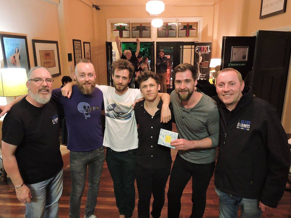 Stevie Connor, Left, and Neil Mitchell, Right, with Irish band The Young Ones, Memo Music Hall, St Kilda, Melbourne, Australia. 