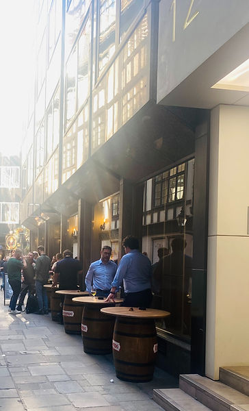 Masons Ave pedestrian alleyway with our Cruzcampo beer barrel tables outside the Masons Arms