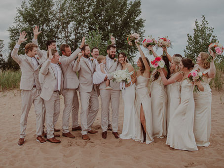 Carrigan and Bob’s love story began at Marquette Golf Club and led to a beautiful September 2025 wedding in Marquette, Michigan. The couple exchanged vows at Clark Lambros Beach Park before celebrating with family and friends at Ore Dock Brewing Company. Their elegant rustic wedding was filled with warm details, heartfelt moments, and the joy of celebrating alongside their daughter.
