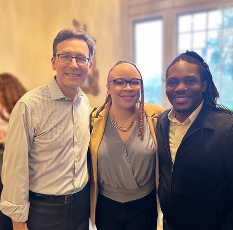 Washington Governor Bob Ferguson stands alongside Christina Blocker and Keith Blocker at his birthday celebration at the Governor’s Mansion. The group is posing together.