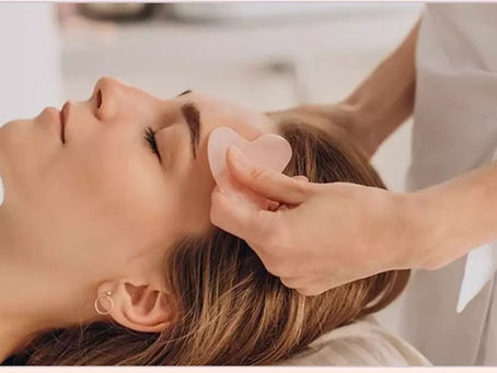 Gua sha facial on woman