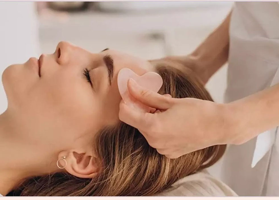 gua sha facial on a woman