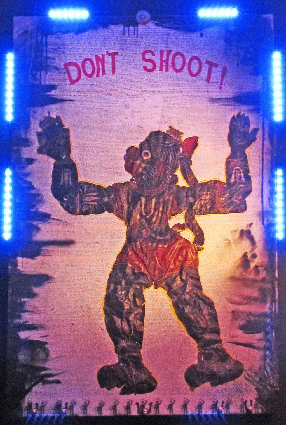 Title; Si’-N-N Networks Presents -Hanuman and the Arrested Development’. This collage of a monkey god puppet is superimpose