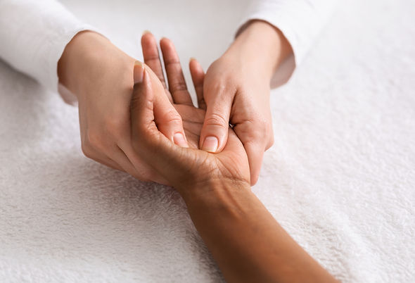 Therapist examining hand