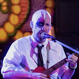 Rock & Metal on a Tenor Ukulele, with some facepaint by 43 year old white guy doing his best...  A story-teller at heart, Garrett creates a unique blend of rock, progressive, and Americana. Armed with his trusty Ukulele and powerful voice, Garrett’s music has been described as "hopeful" and “incredible, unique, and filled with wonder”.   He released his first EP in January, 2021, and the 1st single, "The Climb", was featured on an episode of the podcast, "The Landscape".  Whether performing with heavy metal, rock, or folk/americana artists; for fundraisers, or at house parties & nationwide music venues; Garrett is versatile, engaging, and entertaining for every crowd.