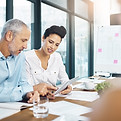Tablet, business people and team training in meeting, discussion or brainstorming startup