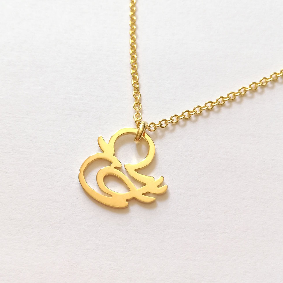 Thumbnail: Gold chick necklace. The bird shape is designed with Japanese word that means chick.