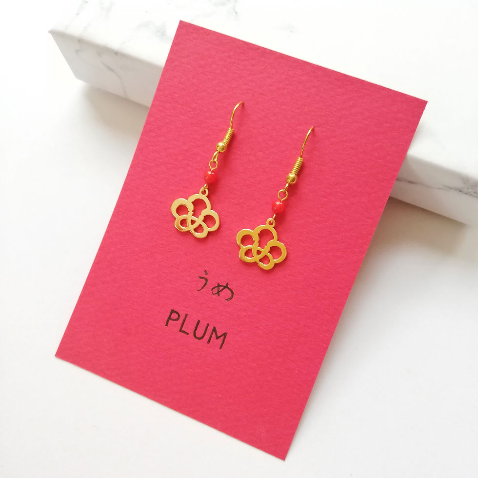 Thumbnail: Gold plum blossom earrings set on a red card. The word plum is written in Japanese and English.
