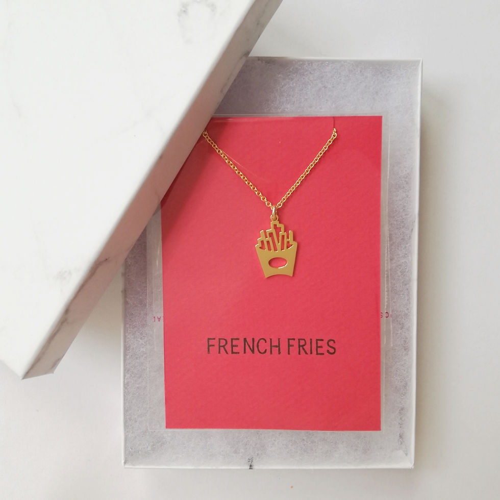 Thumbnail: Gold french fries necklace.  The top is flat shiny and cutout.