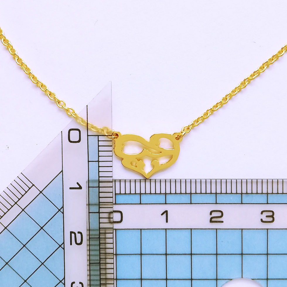 Thumbnail: Gold landscaped heart necklace. The hear shape is embedded with Arabic word that means love.