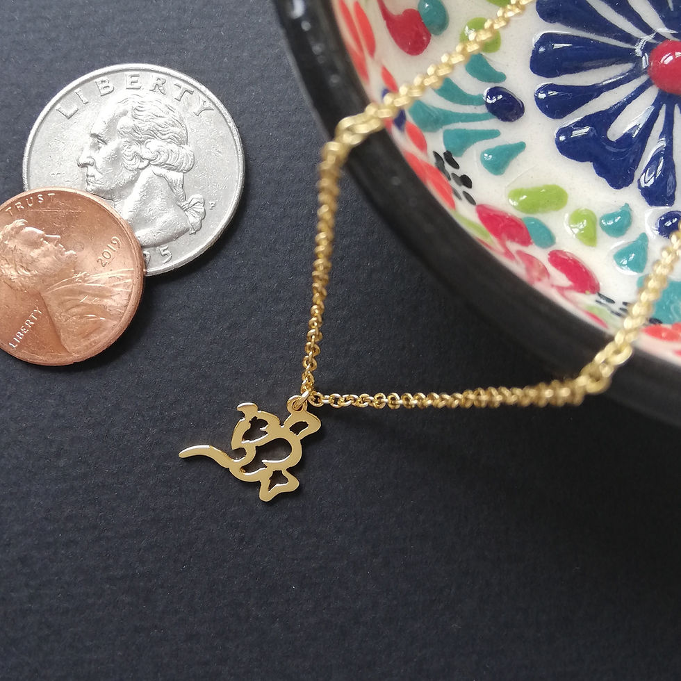 Thumbnail: Gold oil lamp shape pendant top with chain on black board. the chain is hanging down from Persian porcelain.