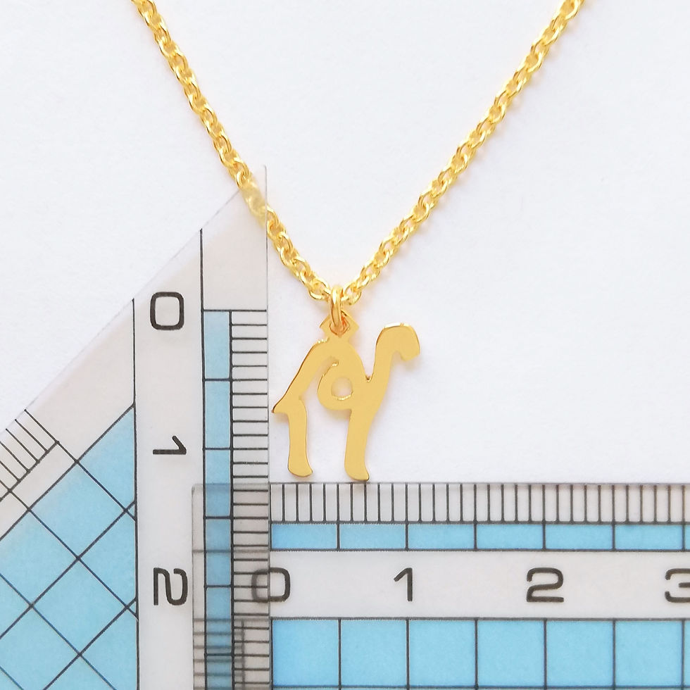 Thumbnail: Two rulers showing the size of gold camel necklace pendant top.