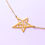 Thumbnail: Right view of Gold asymmetry star bracelet with chain on white surface.