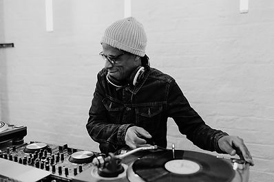 DJ DJing at a party at 100 Barrington, a dry hire venue in Brixton, London