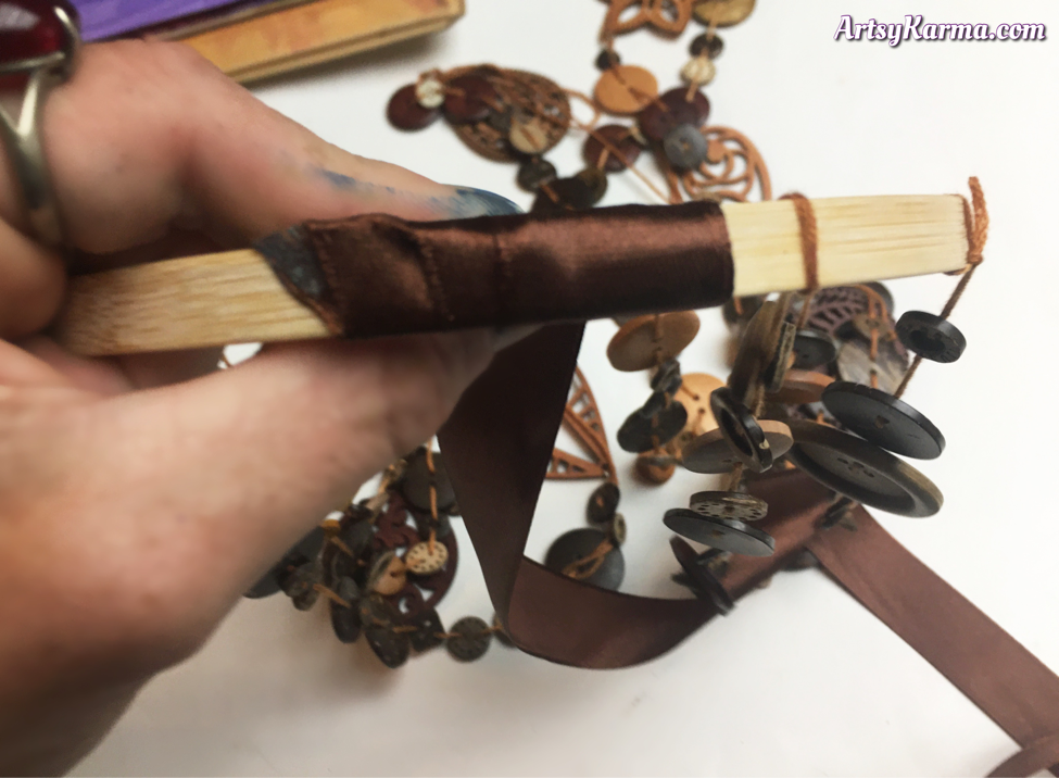 Mobile craft using buttons and ribbon