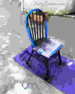spray paint sections of chair black for makeover