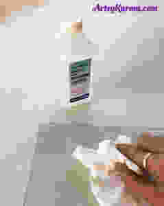 clean glass with rubbing alcohol