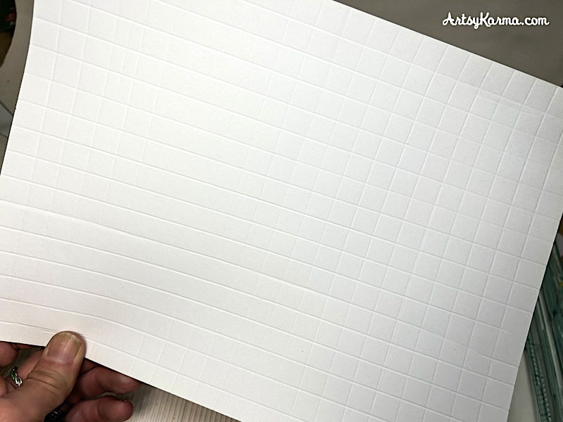 White cardstock with a full embossed grid pattern, ready for inking.