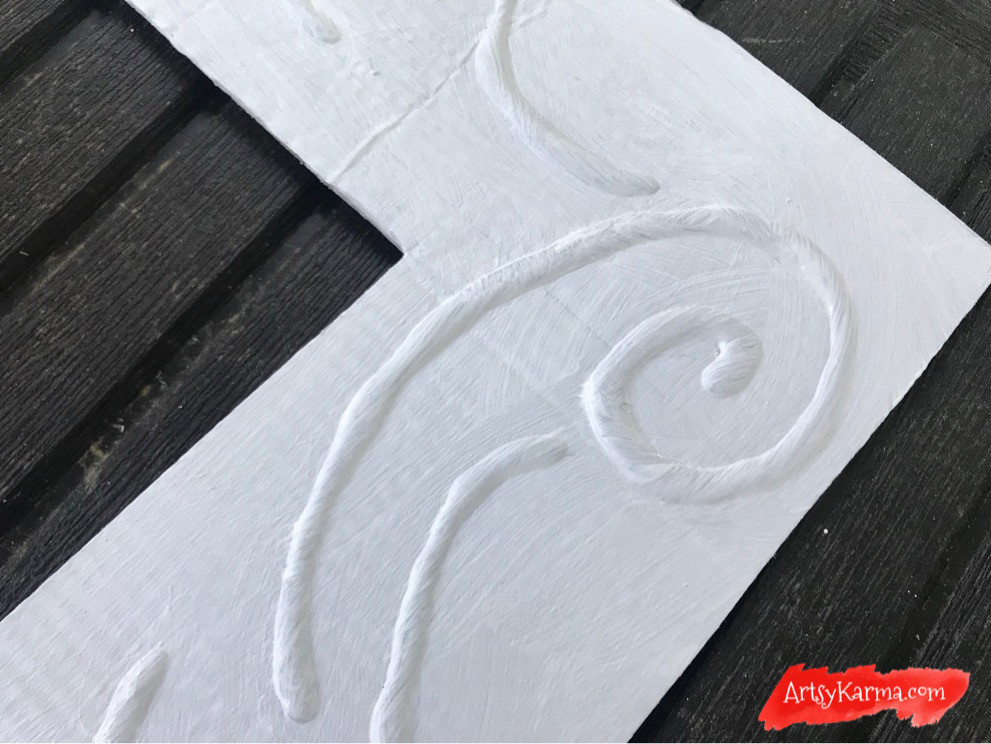 gesso makes the faux embossing uniformed