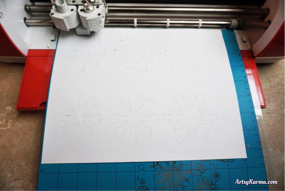 Cut out snowflakes for a diy decor craft