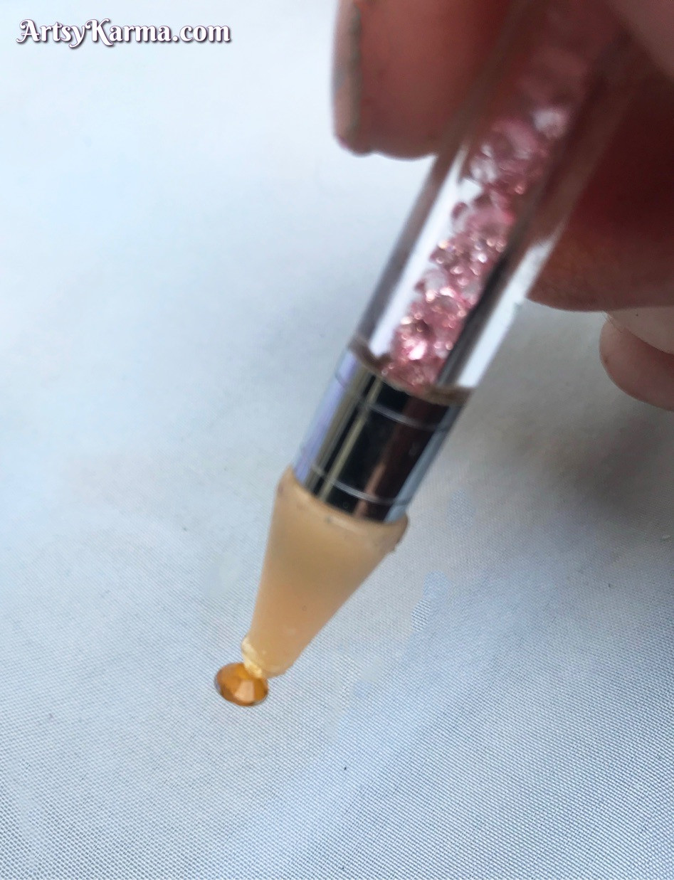 Pick up your rhinestones with a made-for tool