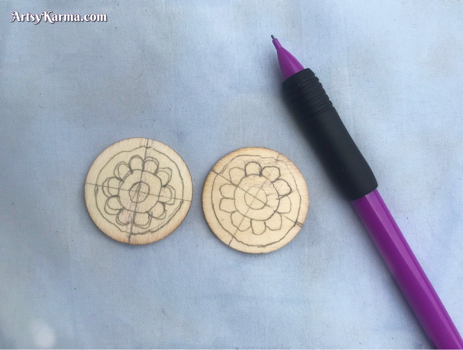 Designing a mandala on wooden slices to decorate with rhinestones
