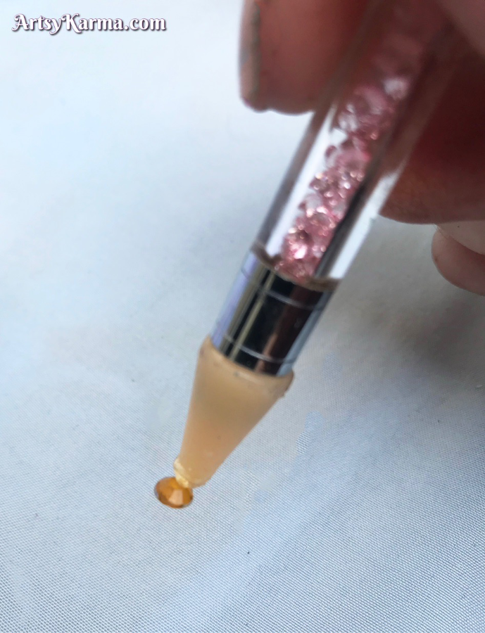 Pick up your rhinestones with a made-for tool