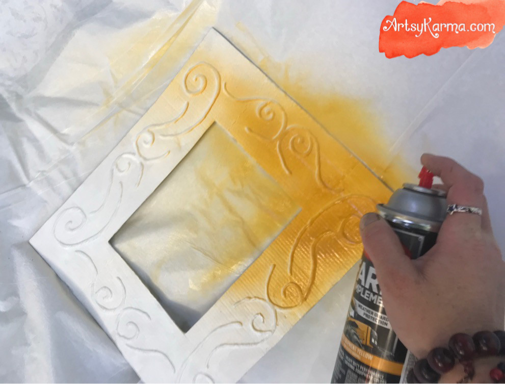spray paint the embossed frame
