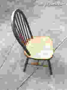a charred wooden chair