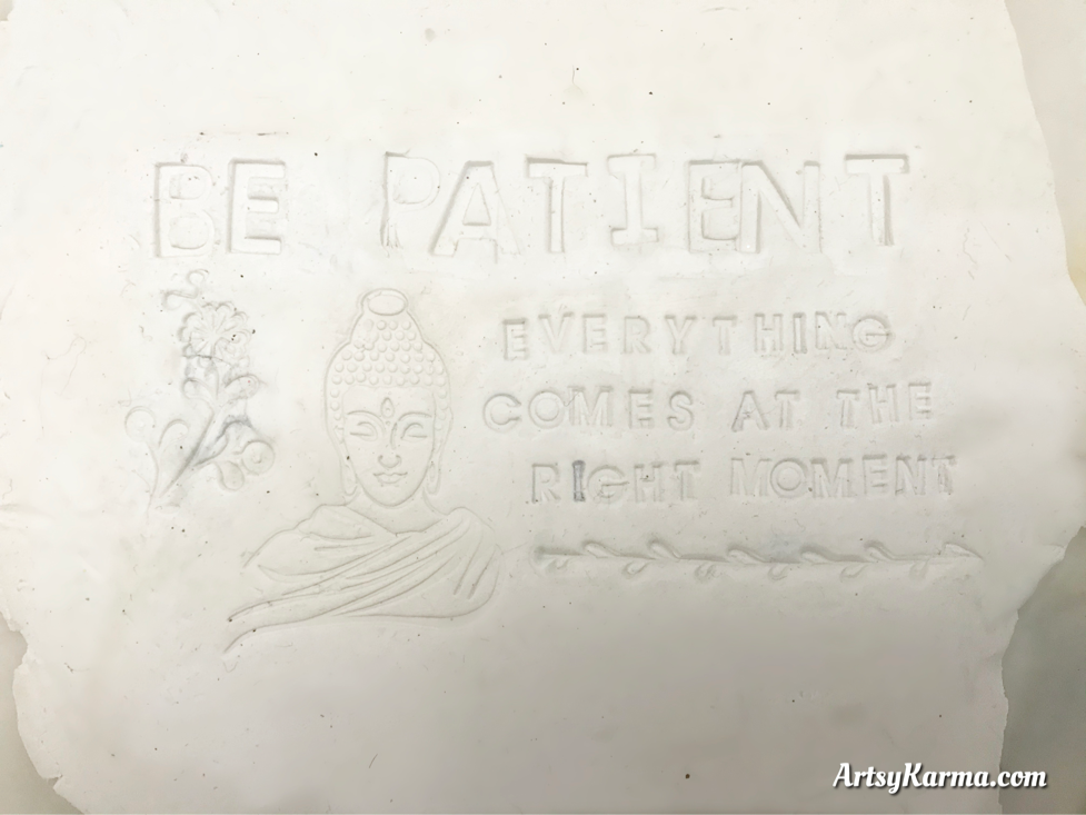 stamp into clay