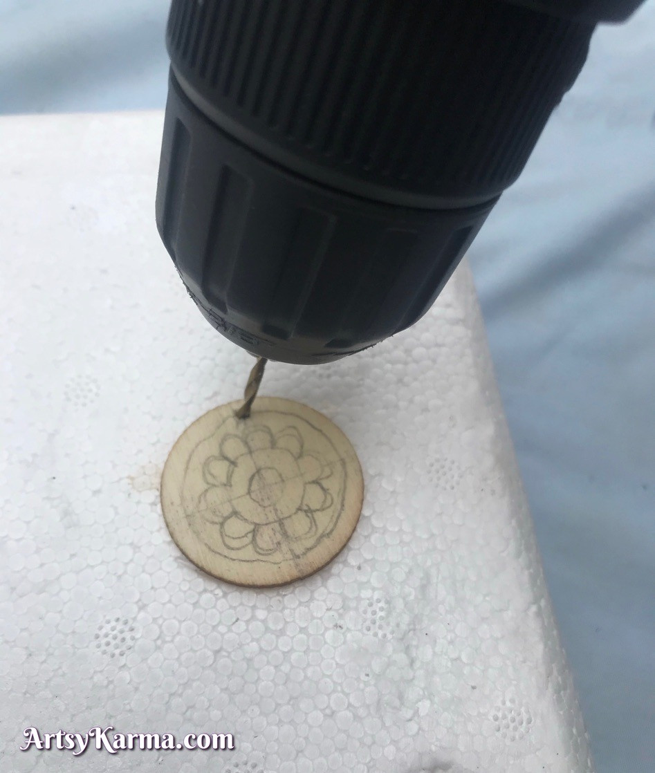 Drill a hole in your wood slice to add jump rings to make into earrings