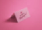 Folded pink thank you card featuring a cherry icon and the text We want to thank you on a pink background.