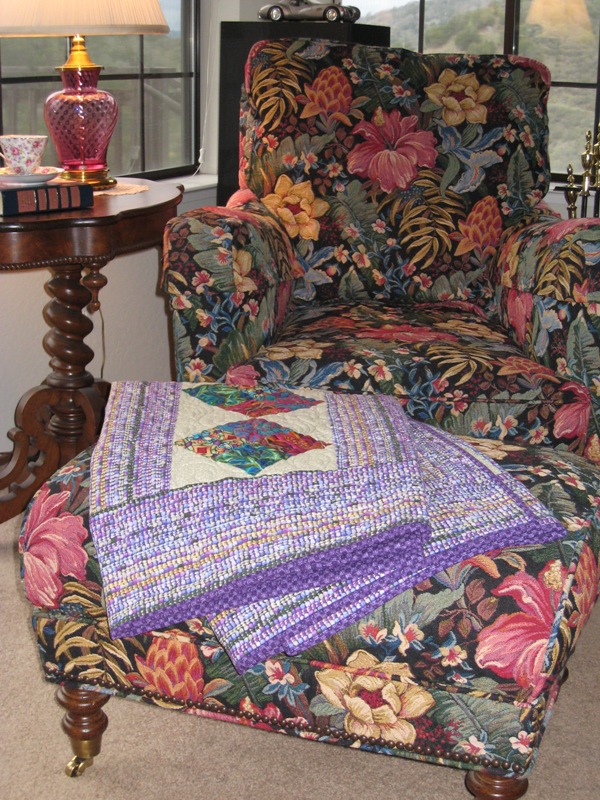 Jewel Tone Quilt on an ottoman