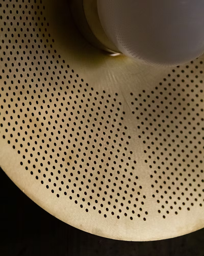 Brass sculptural pendant lamp, handcrafted contemporary lighting piece.