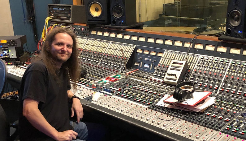 image of chris wright in front of a mixing board