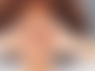 A woman making a heart shape with her hands