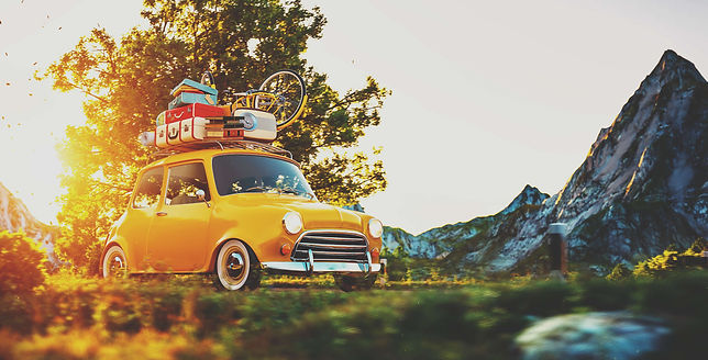 Yellow Mini with luggage on the roof