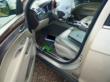 A laptop and equipment configured to download a vehicle's black box data.