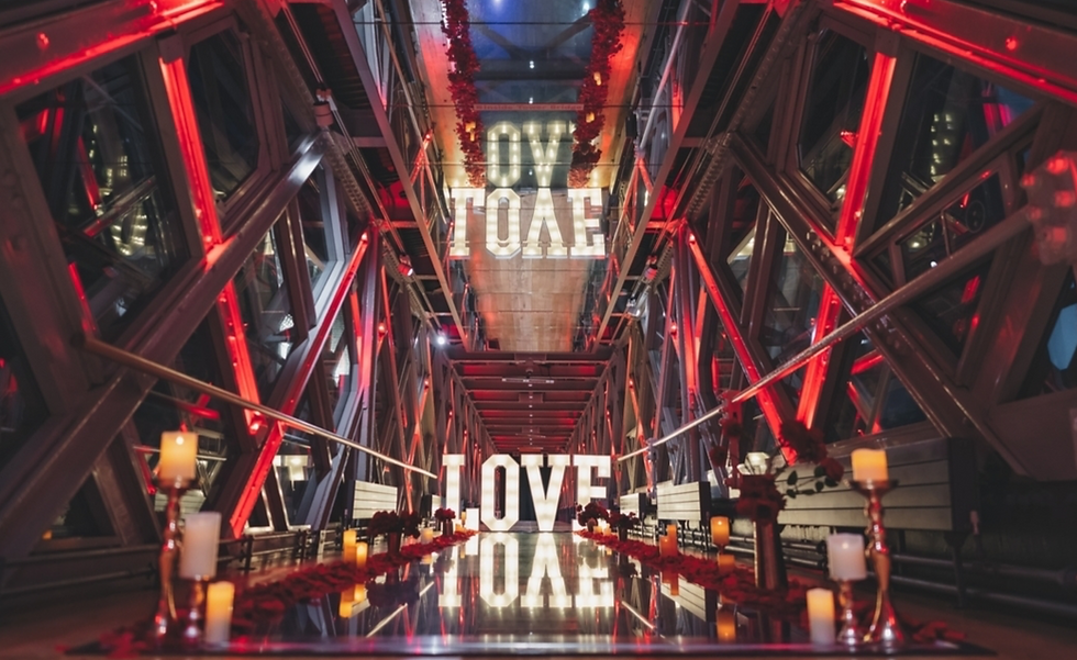 Ambient proposal set up. Red proposal them with large LOVE letters in Tower Bridge for perfect Tower Bridge proposal