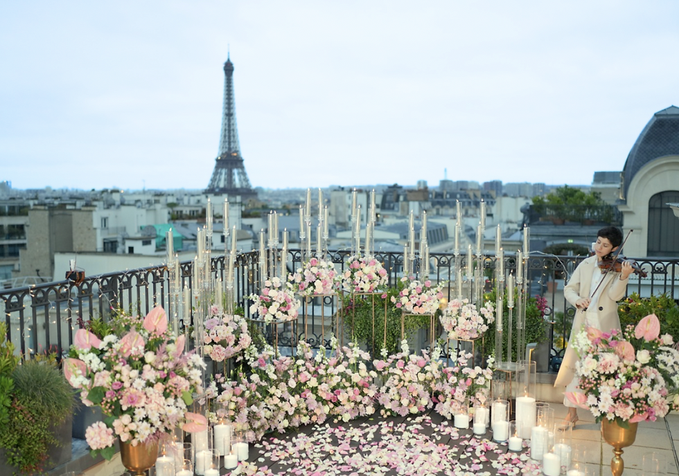 Pink marriage proposal in Paris in Eiffel Tower roof terrace