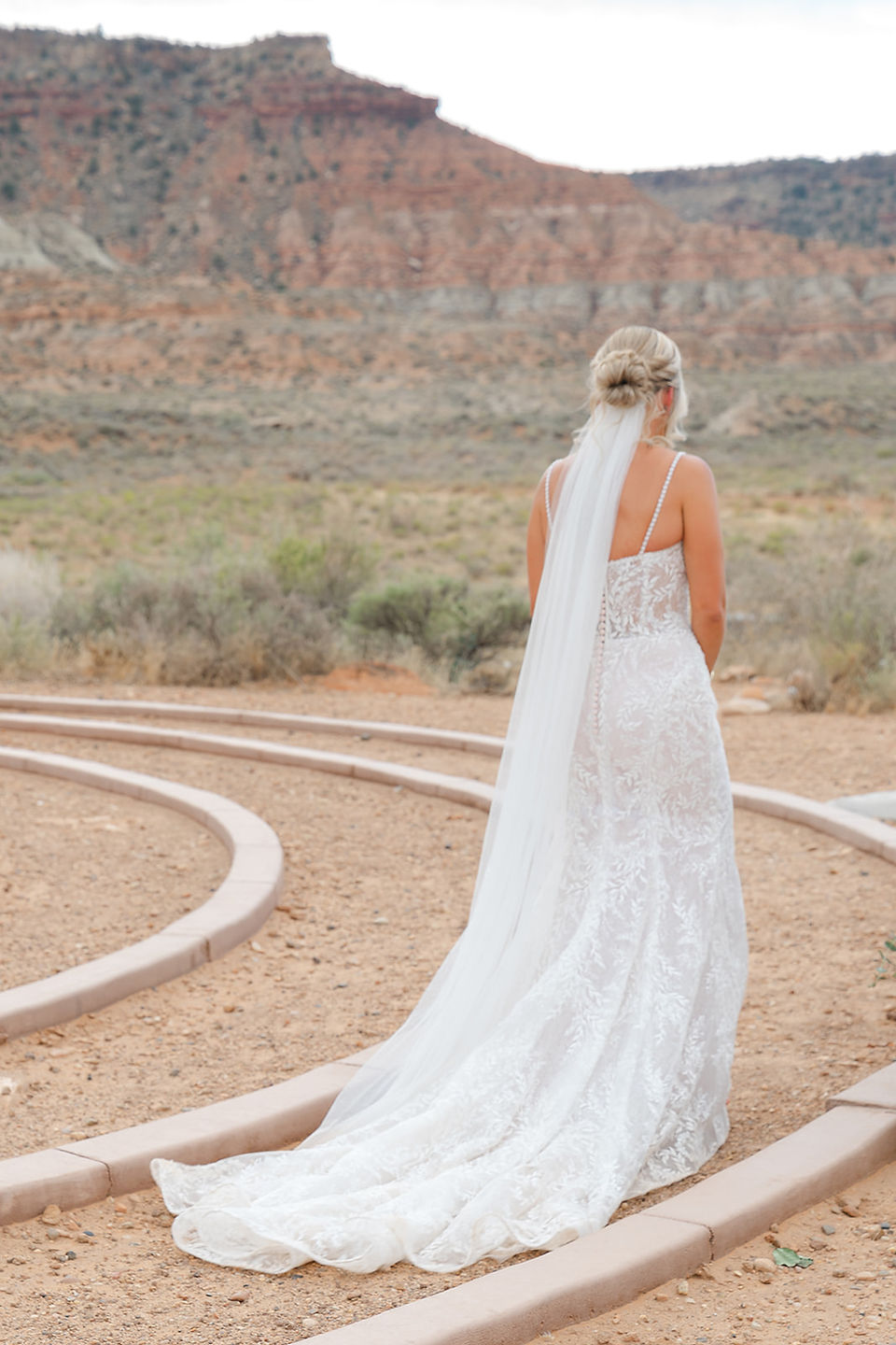 The bride approaching the altar during a desert ceremony near Zion National Park.